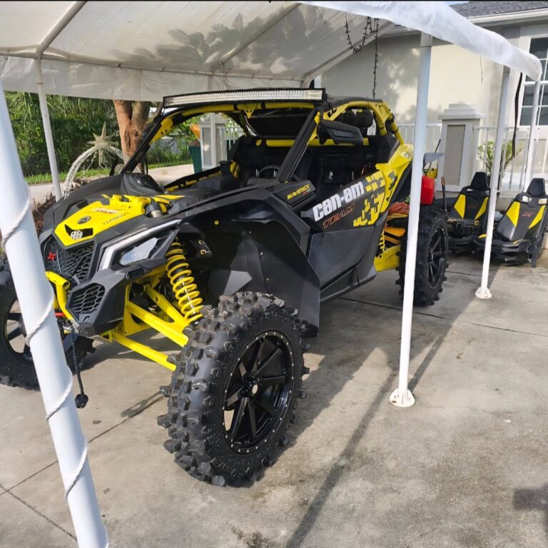 Side-by-side UTV staged for diagnostics and repair at M33 Powersport Performance in Ormond Beach, Florida