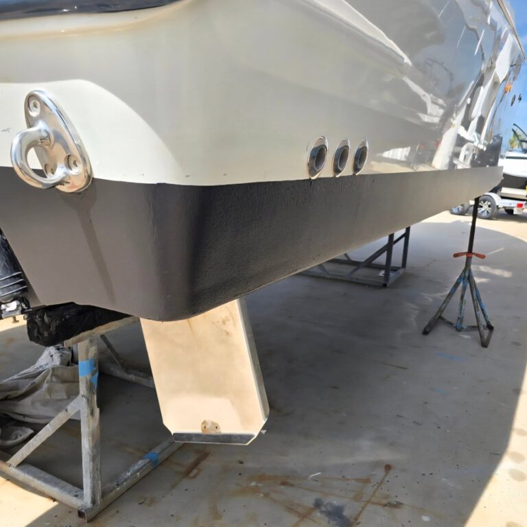 Boat hull bottom and lower unit cleaned during exterior detailing work