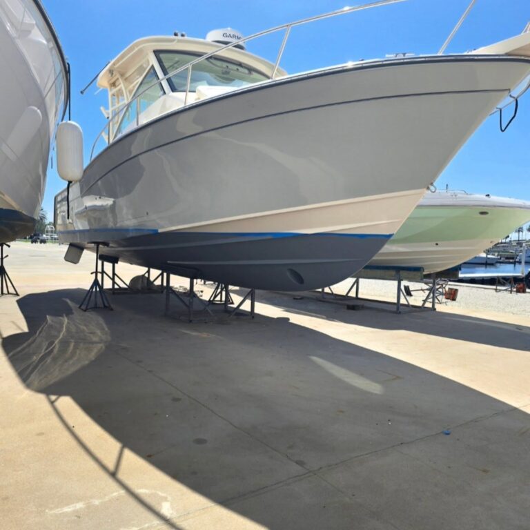 Boat hull with restored gloss after professional detailing by M33 Powersport Performance