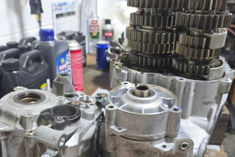 Powersports engine internals and gear assembly disassembled for inspection and rebuilding